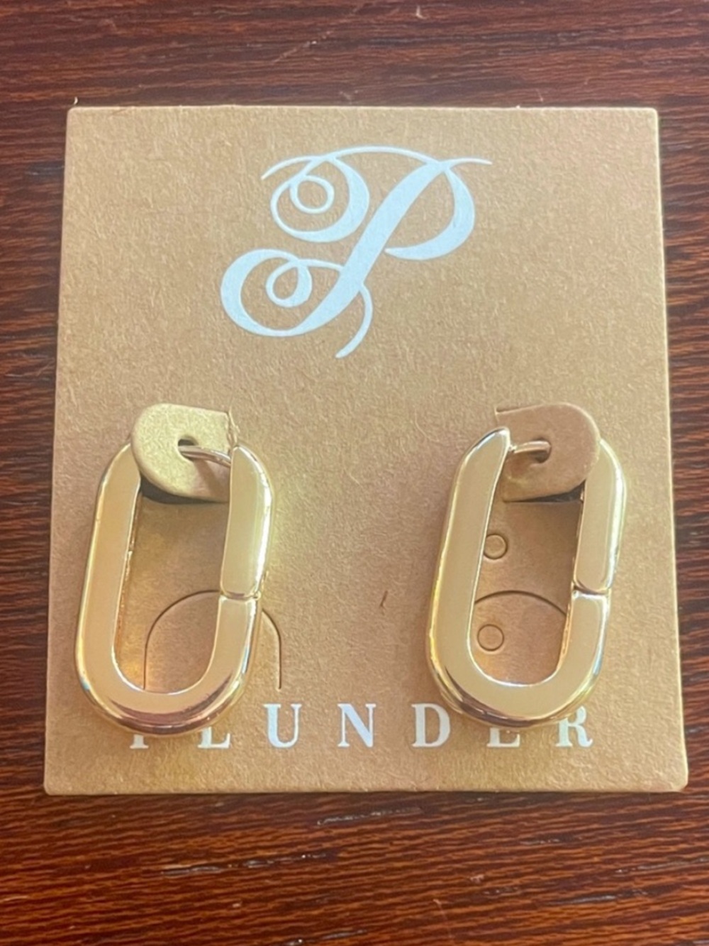 Plunder Huggie Oval Hoop Earrings. Gold-tone. 1 in drop Hinge closure New in bag